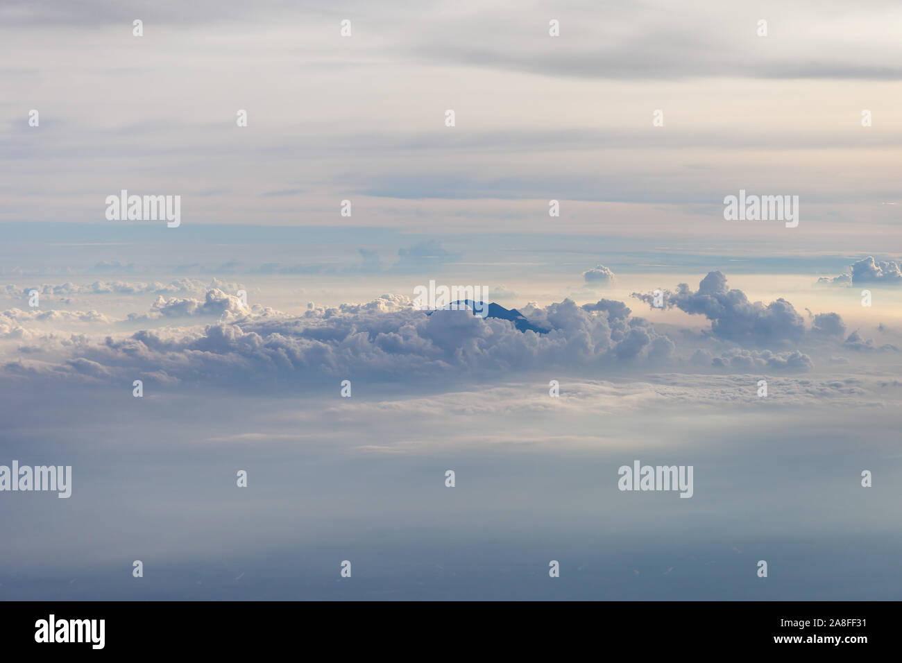 Aerial view of different volcanoes on Java Island. The fog adds to a ...
