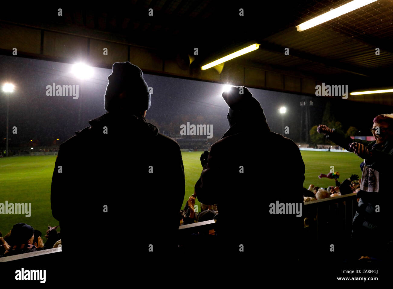 Fans watch the action during the FA Cup First Round match at Champion Hill, London. Stock Photo