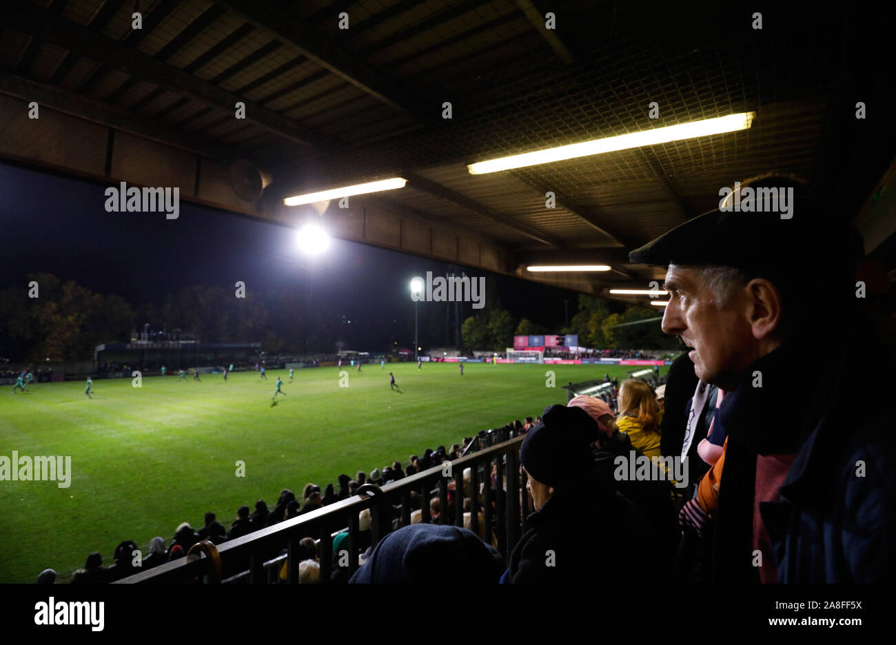 Fans watch the action during the FA Cup First Round match at Champion Hill, London. Stock Photo