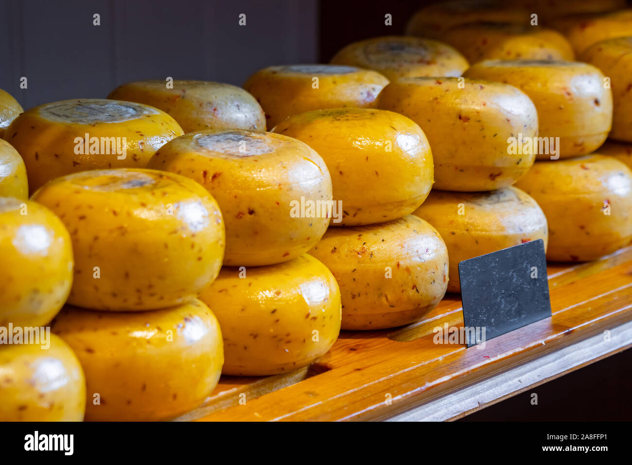 Holland cheese wheels on the shelves in diary production market. Food