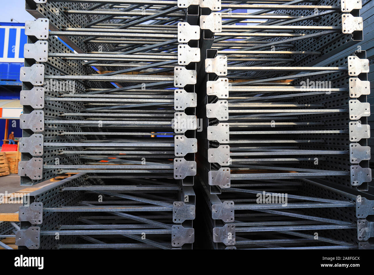 Gray big metal mobile shelving stacked in a warehouse of a construction shopping center. Shelves for placement and storage of goods in building Stock Photo