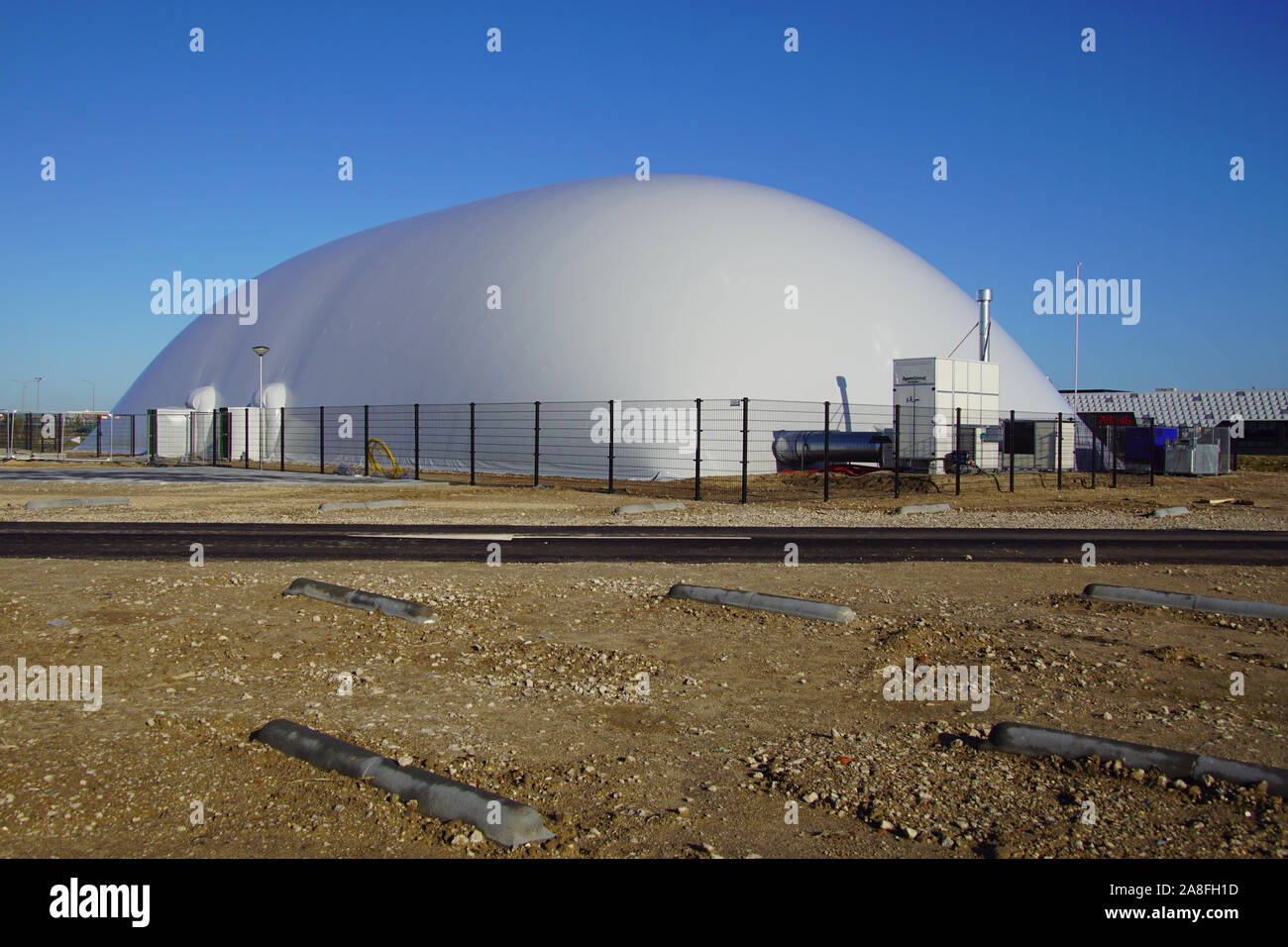 Almere Poort, the Netherlands - November 8, 2019: Inflatable dome sports hall against a clear blue sky. Stock Photo