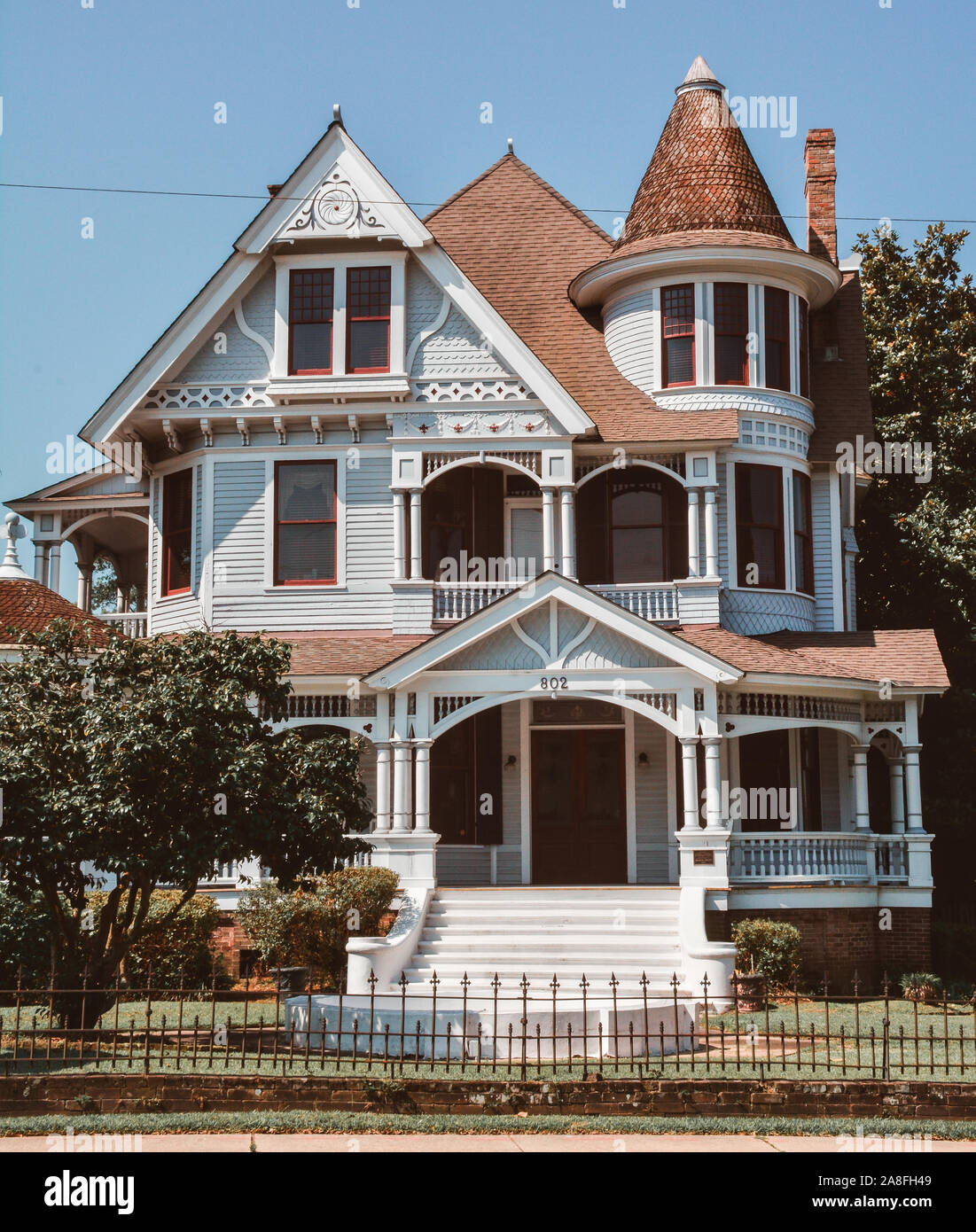 A beautiful example of a vintage Queen Anne house, with it's roofs and