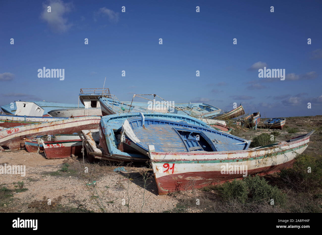 Old fishing boats used by refugees to cross the Mediterranean from