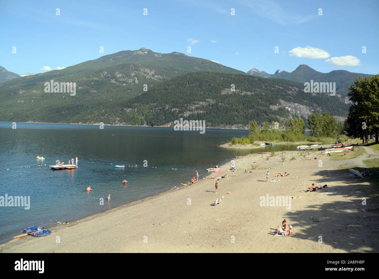 A view of the beach on Kootenay Lake in the alpine town of Kaslo, in Selkirk Mountains, in the Kootenay region of British Columbia, Canada. Stock Photo