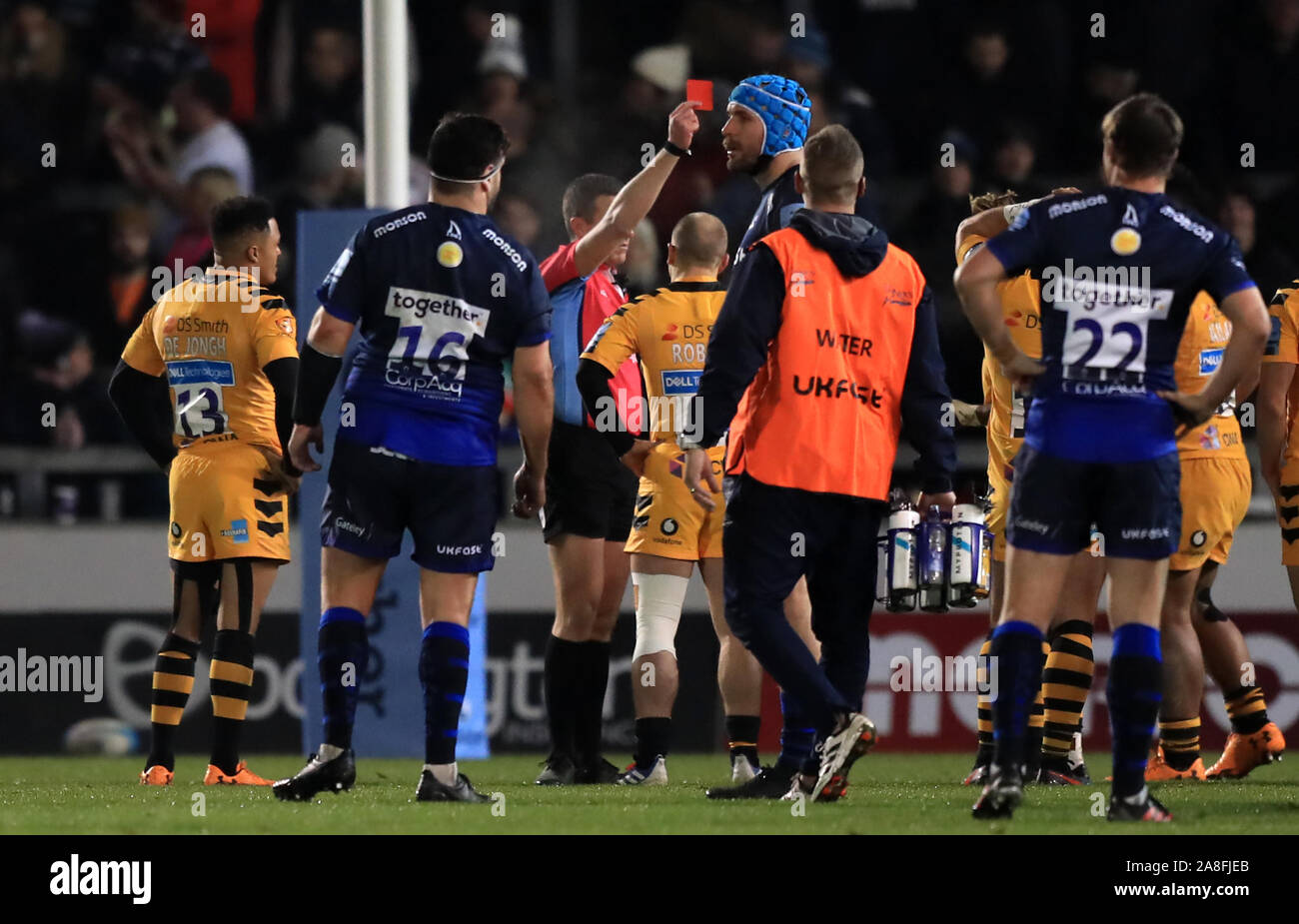 Wasps' Paolo Odogwu (hidden) is shown a red card by referee Tom Foley ...
