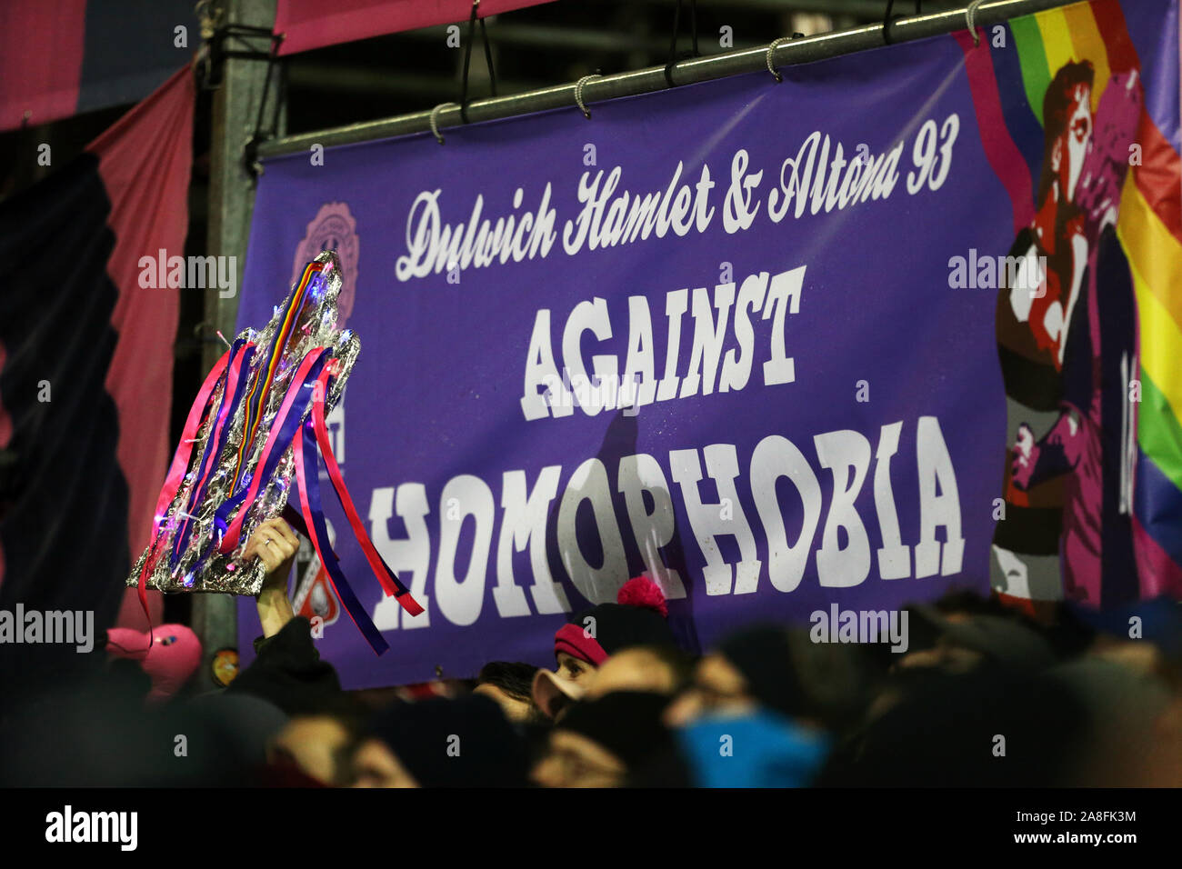 Dulwich Hamlet fans with a banner reading 'Against Homophobia' during the FA Cup First Round match at Champion Hill, London. Stock Photo