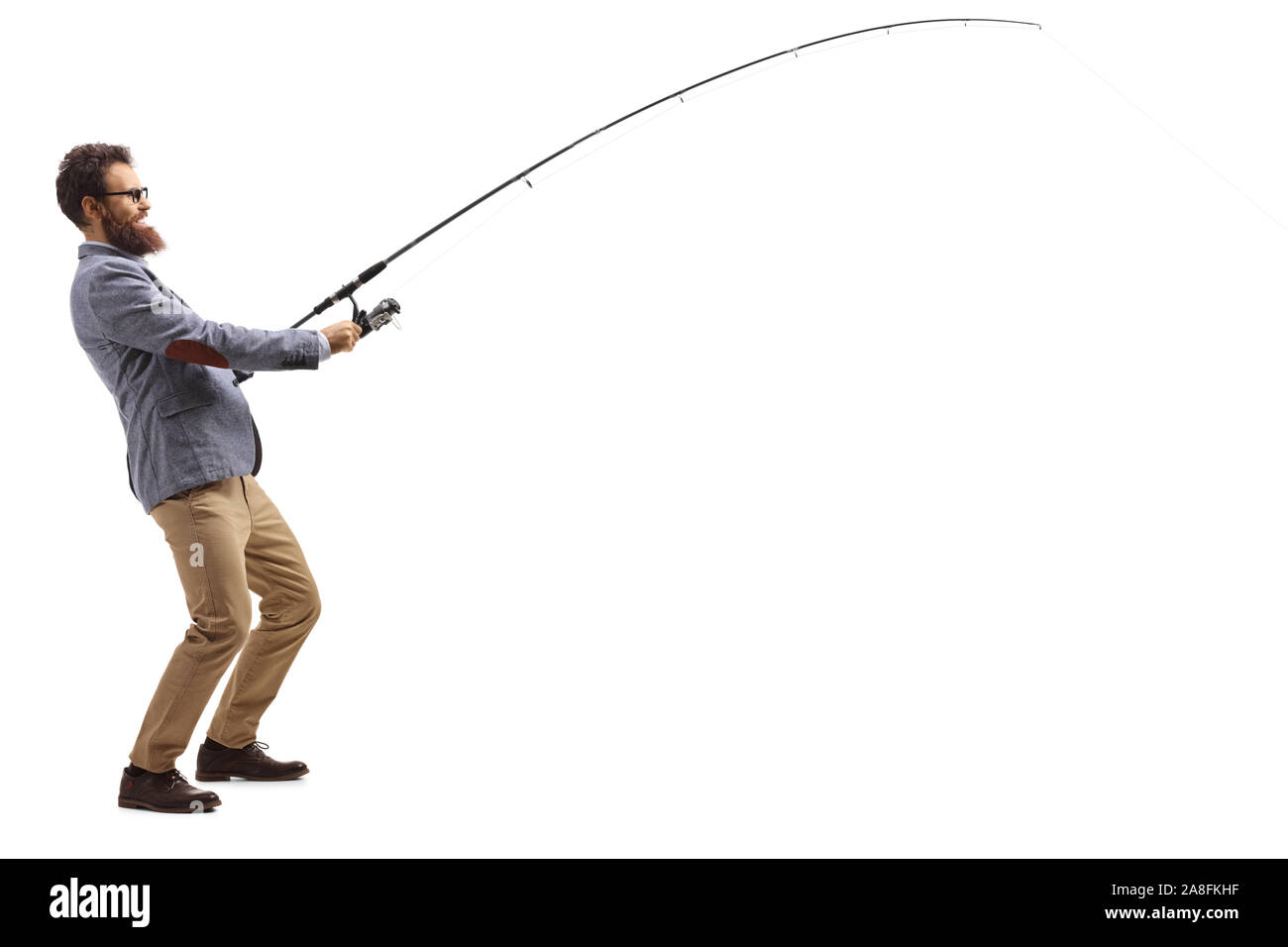 Full length profile shot of a casual man pulling a fishing rod