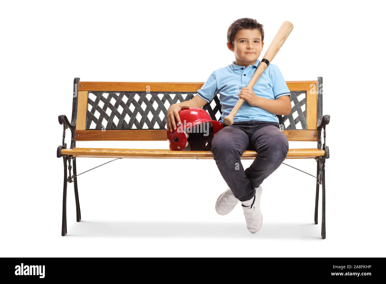 Boy sitting on a bench with a baseball bat and a helmet isolated on white background Stock Photo