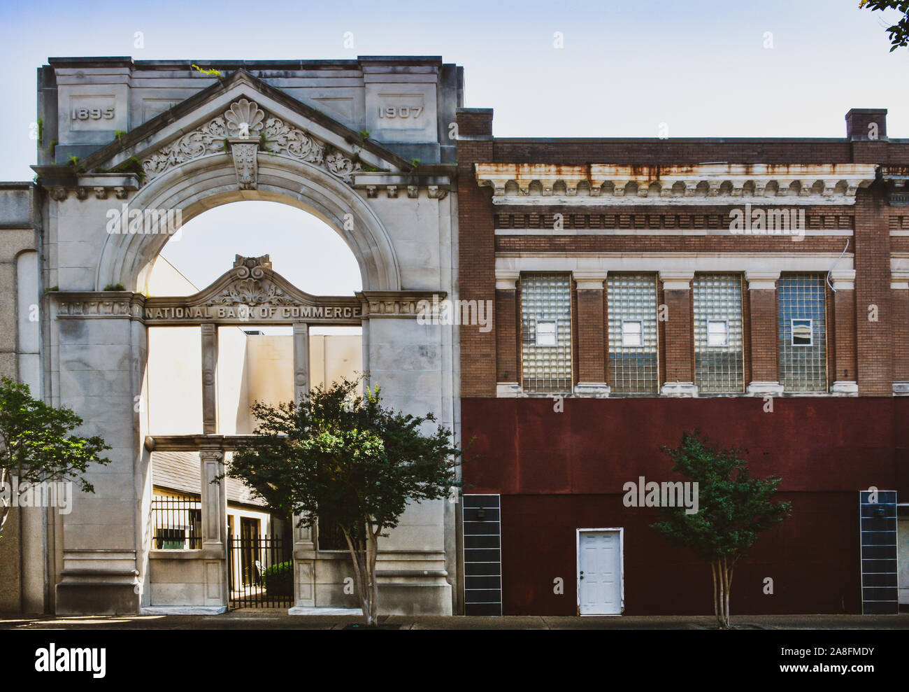 A historical building of Neoclassical design has facade left intact while the remainder of the building was demolished in Hattiesburg, MS, USA Stock Photo