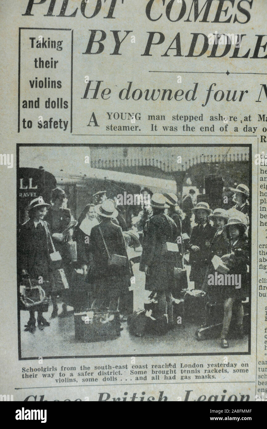 Photo story showing children being evacuated from London in the Daily Express newspaper (replica) on 31st May 1940 during the Dunkirk evacuation. Stock Photo