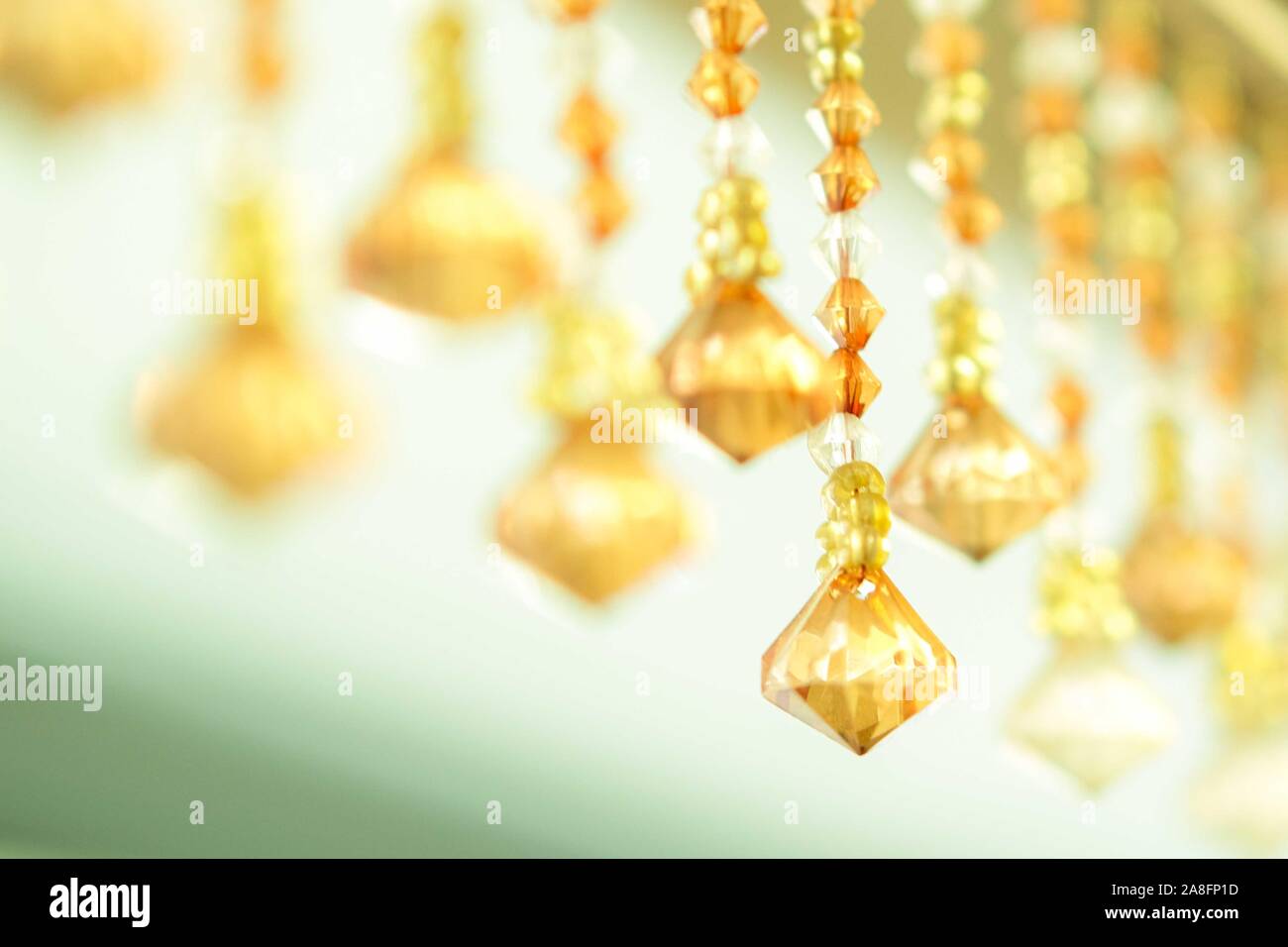 Chrystal golden yellow elements close-up. Selective focuse. Stock Photo