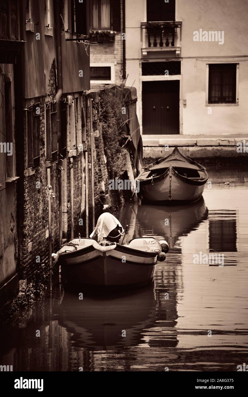 Boat park in Venice alley canal. Italy Stock Photo - Alamy