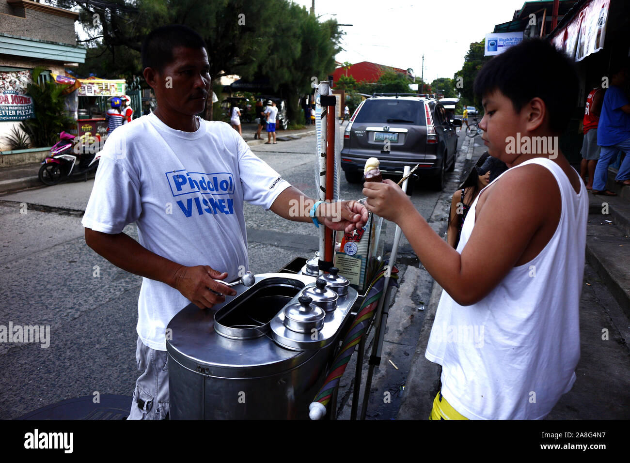 ANTIPOLO CITY, PHILIPPINES – NOVEMBER 2, 2019: Young Filipino boy buys