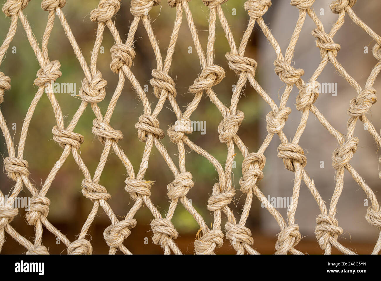 Close up of the knots on a traditional fishing net made by knotting