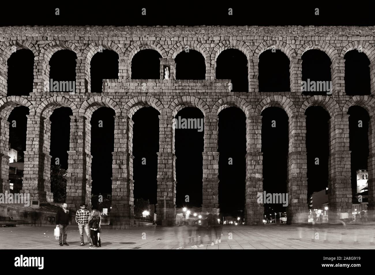Ancient Roman aqueduct closeup view in Segovia at night Stock Photo - Alamy