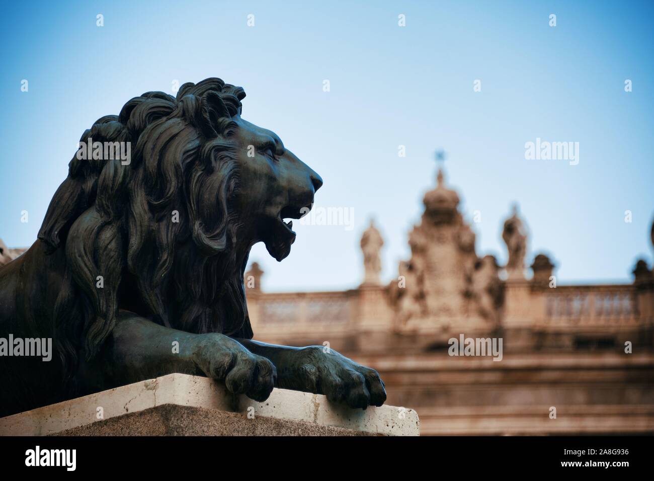 Lion statue in front of Royal Palace closeup view in Madrid Spain Stock