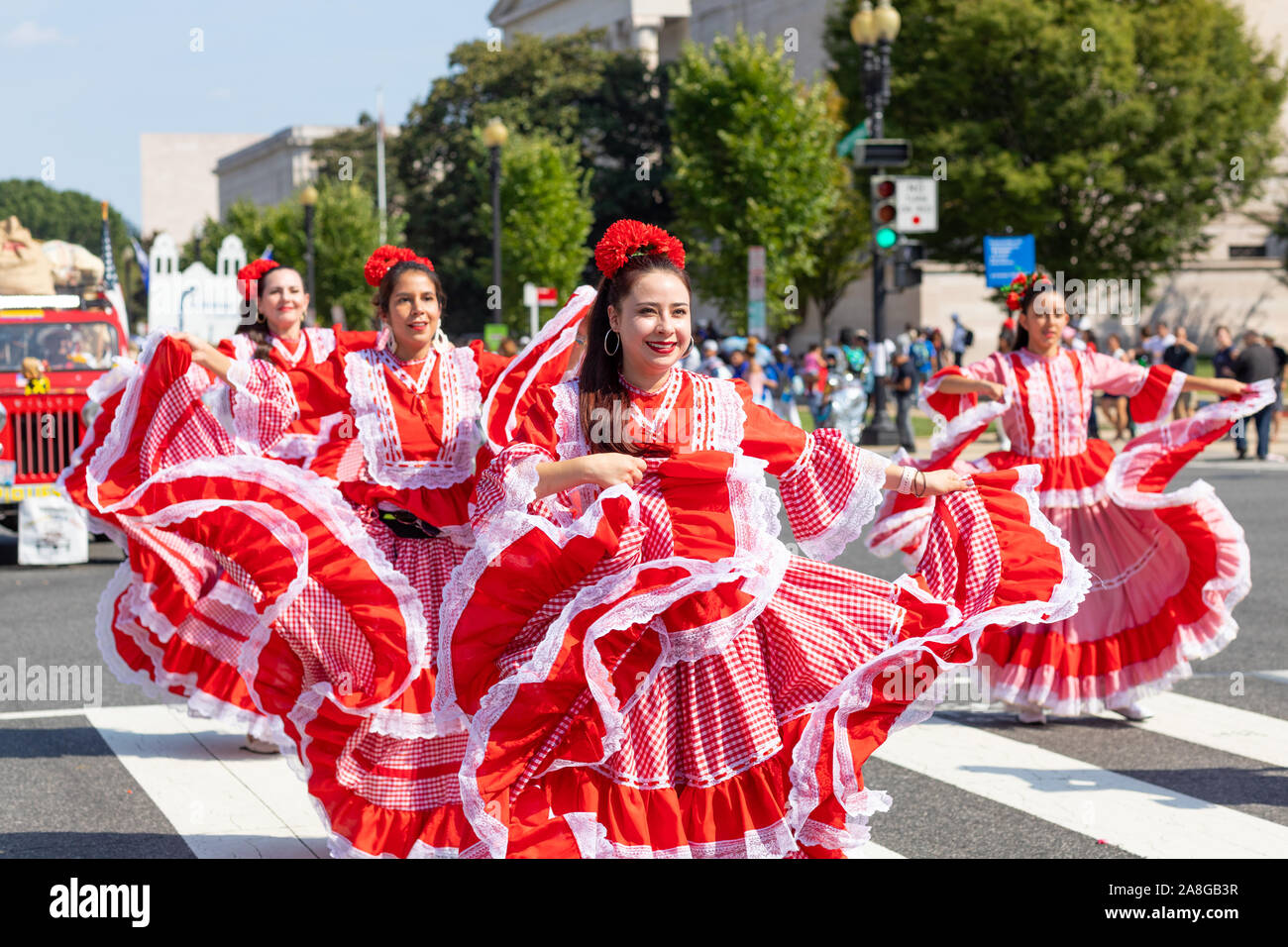 Washington DC, USA - September 21, 2019: The Fiesta DC, Colombian women wearing traditional clothing, performing Cumbia dance during the parade Stock Photo