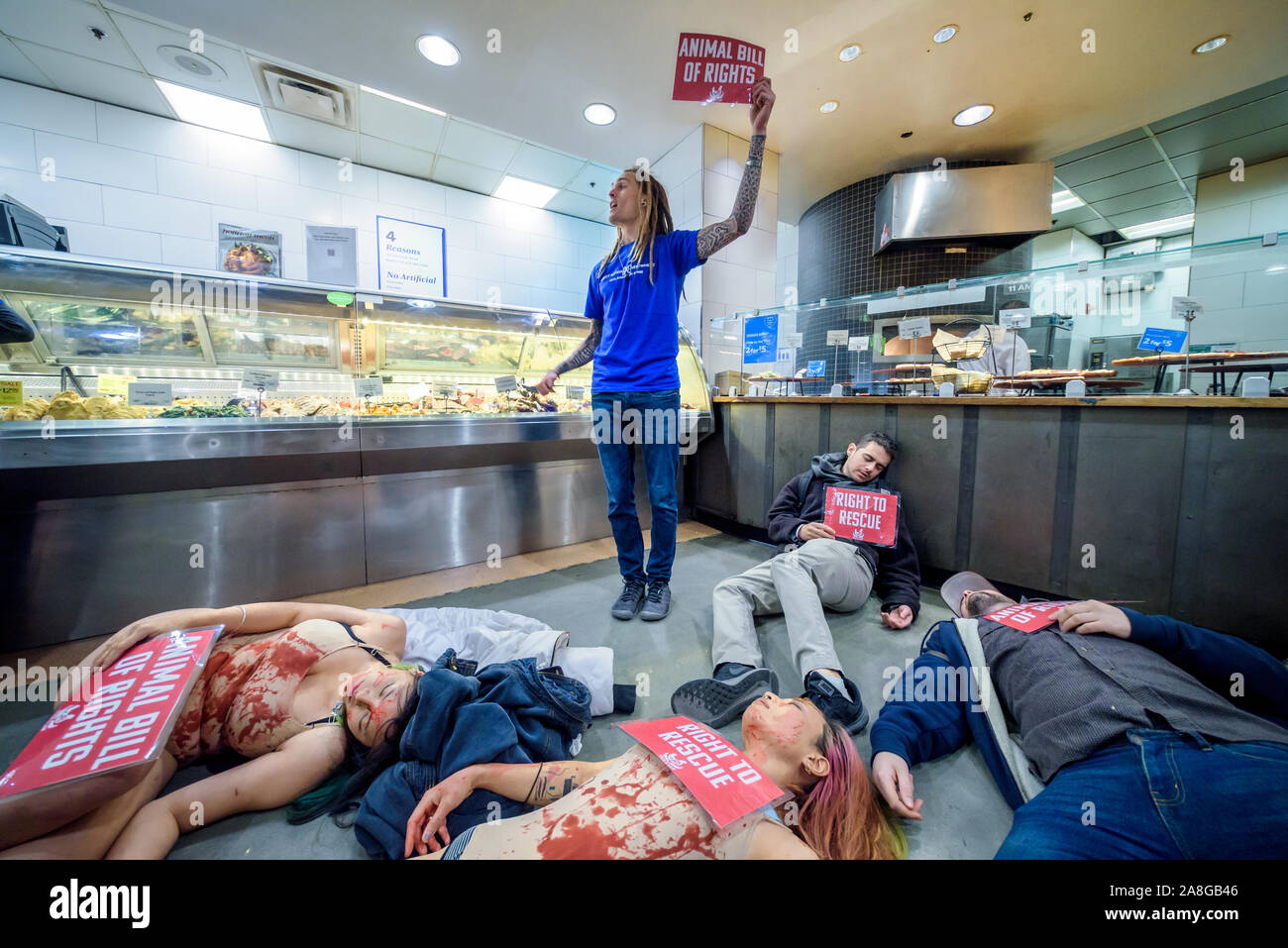 New York, USA. 8th Nov, 2019. Animal liberation activists with the  grassroots animal rights network Direct Action Everywhere (DxE) disrupted  business as usual inside Whole Foods, a business owned by Amazon, staging