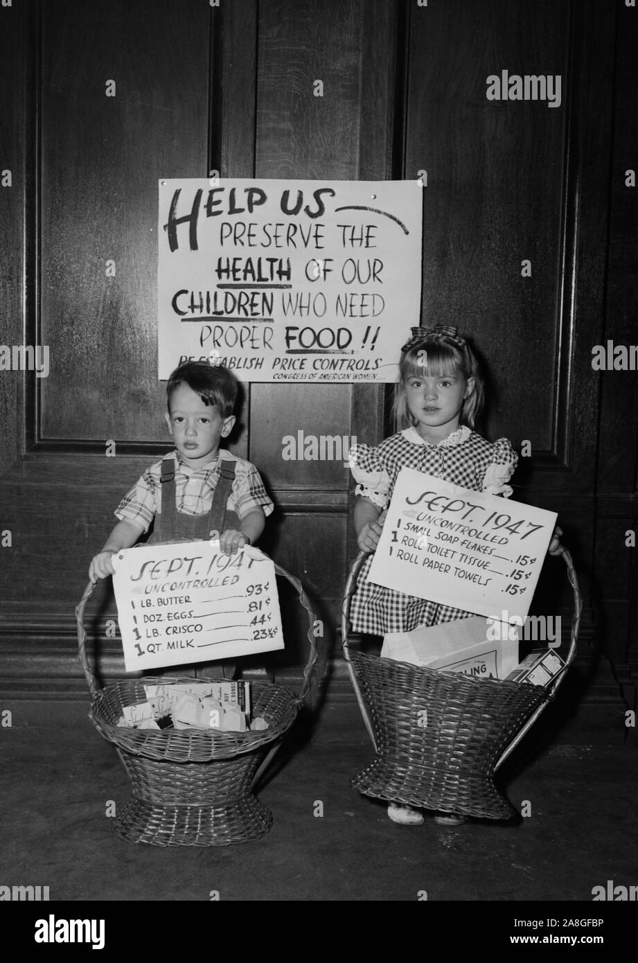 Two children protest uncontrolled consumer prices during the post-World War II period, ca. 1948. Stock Photo