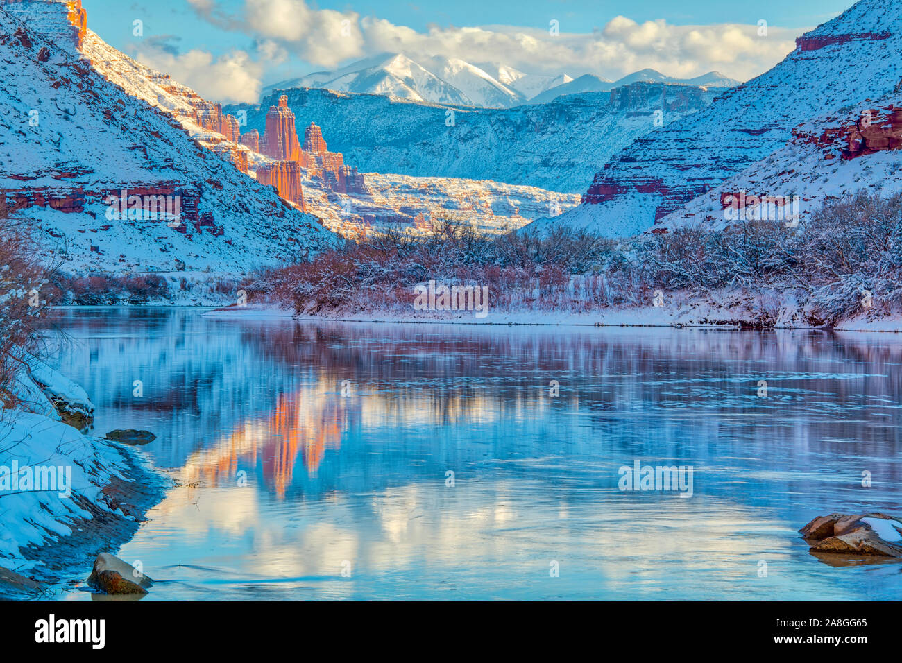 Winter along the Colorado River with Fisher Towers, Fisher Mesa, and La Sal Mountains reflection, Near Moab, Utah Stock Photo