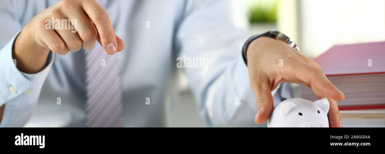 Hand businessman putting pin money Stock Photo Alamy