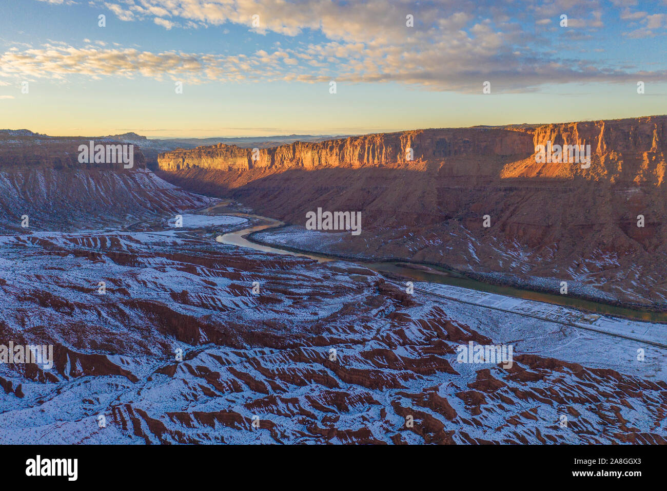 Colorado River and badlands near Moab, Utah, winter snow at sunset Stock Photo