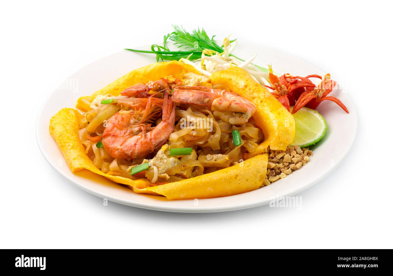 Thai Fried Noodles with Shrimps and egg wrapped Pad Thai Style Thai Food Popular Street food served Baby Bean Sprouts ,spring onions and chili side vi Stock Photo