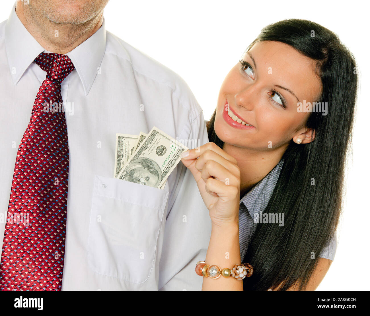 Junge Frau, 25, 30, Jahre,  zieht einem Mann Geld aus der Tasche, US-Dollars, MR:Yes Stock Photo