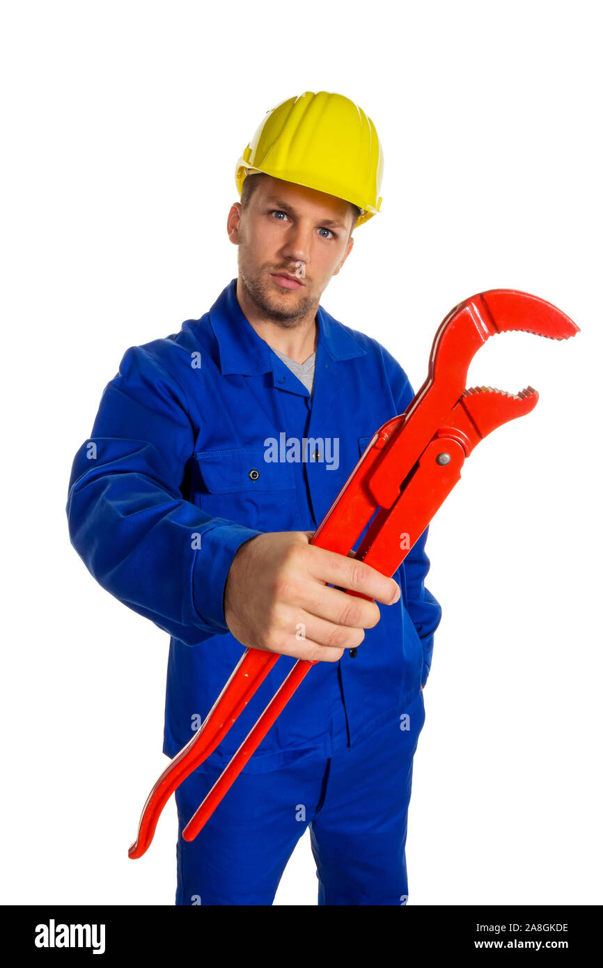 Ein Arbeiter in einem Gewerbebetrieb ( Handwerker ) mit Werkzeug in der Hand, Rohrzange, 30, 35, Jahre, MR:Yes Stock Photo