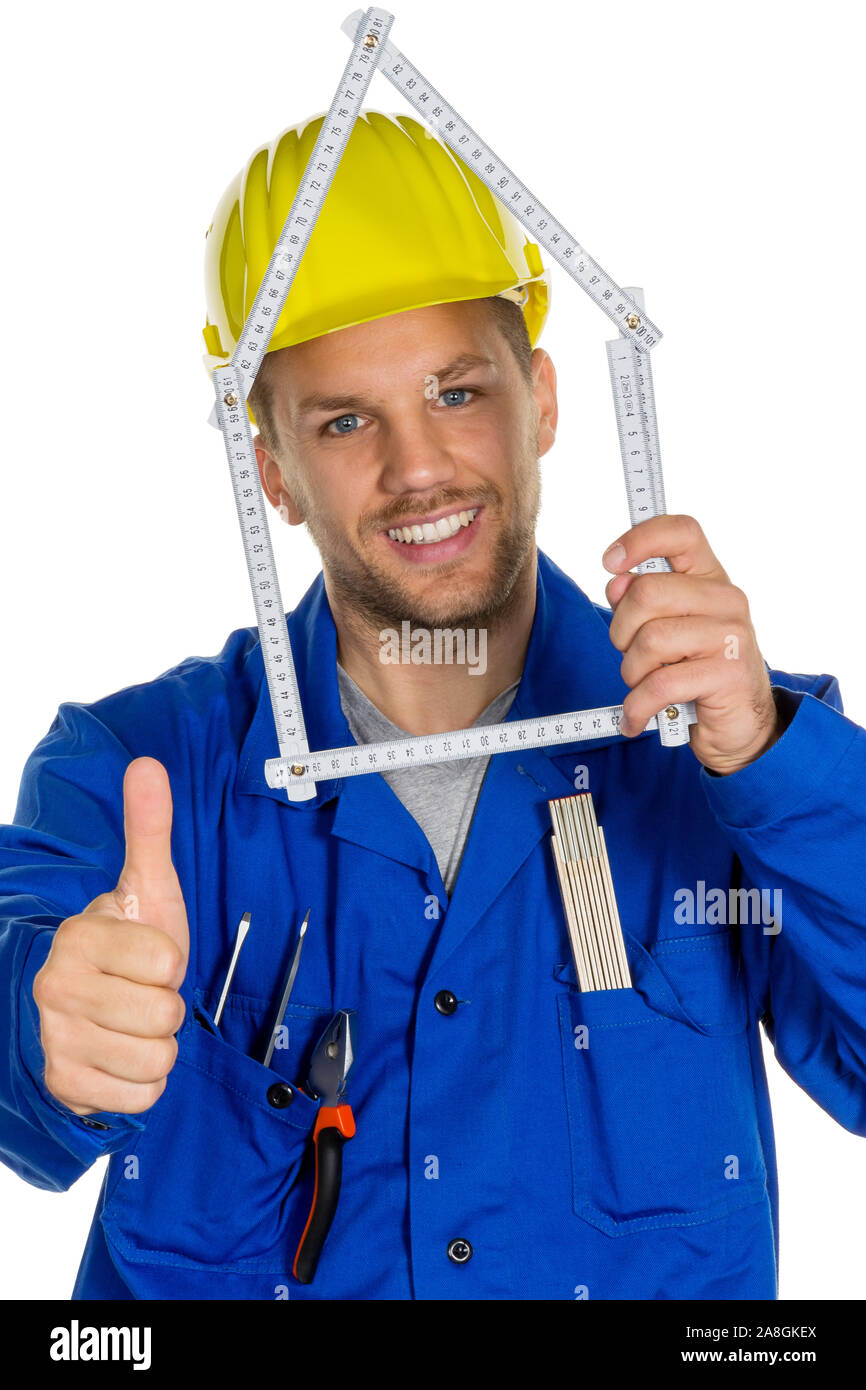 Ein Arbeiter in einem Gewerbebetrieb ( Handwerker ) mit Helm will ein Haus bauen. Stock Photo