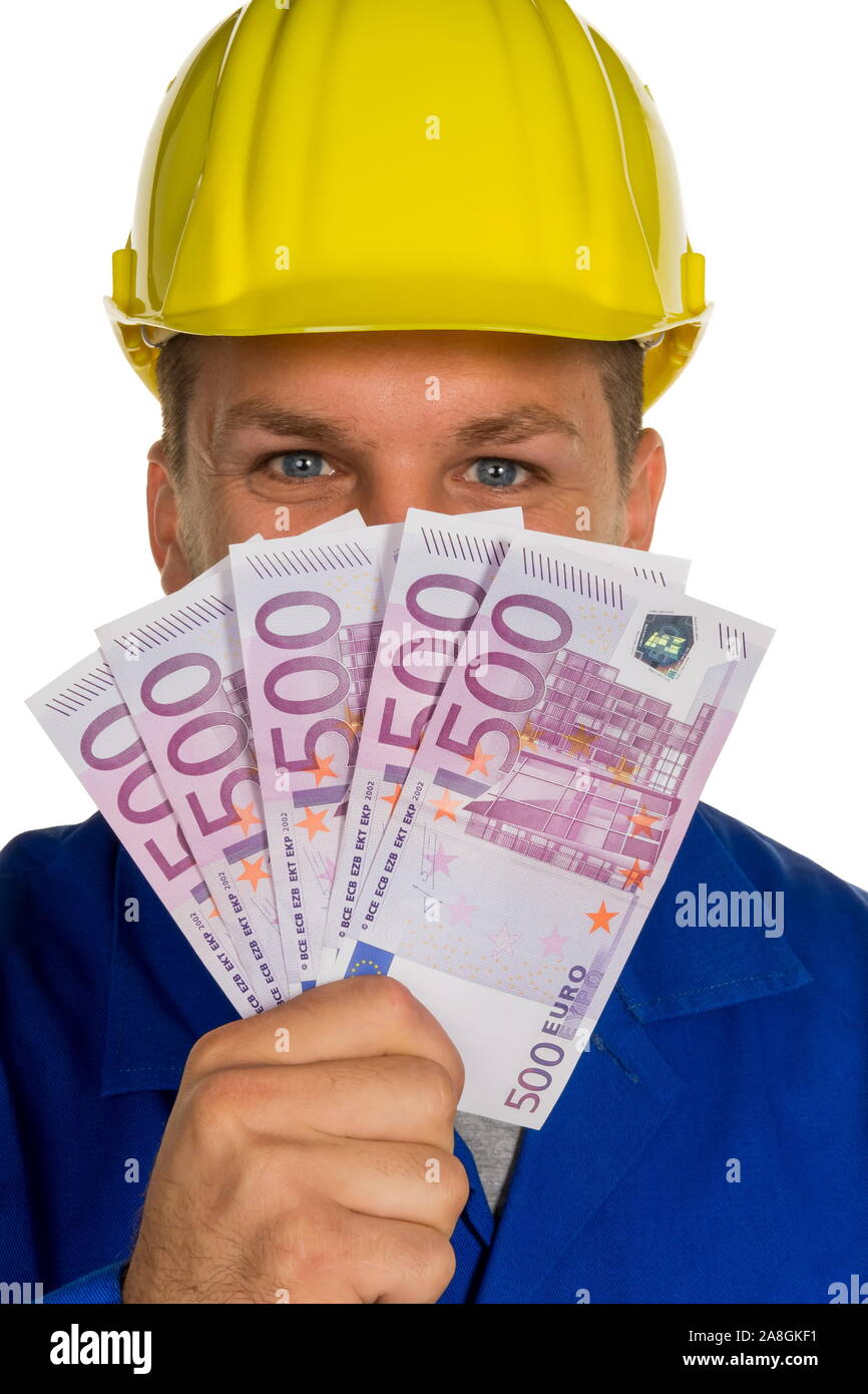 Ein Arbeiter in einem Gewerbebetrieb ( Handwerker ) mit 2500 Euro in der Hand, 5 x 500 Euro, MR: Yes; 25, 30, Jahre Stock Photo