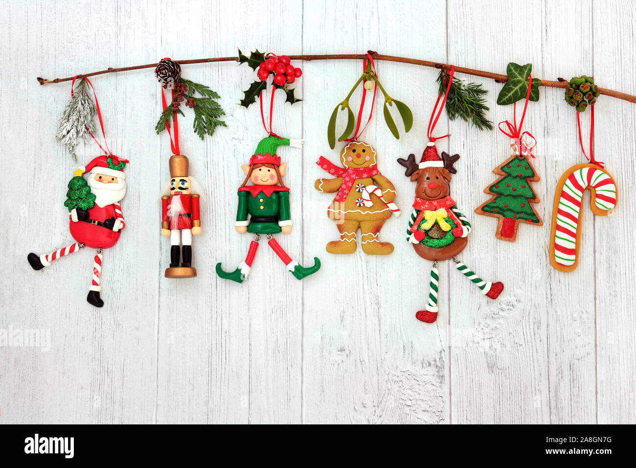 Christmas decorations hanging on a branch with santa claus, tree ...