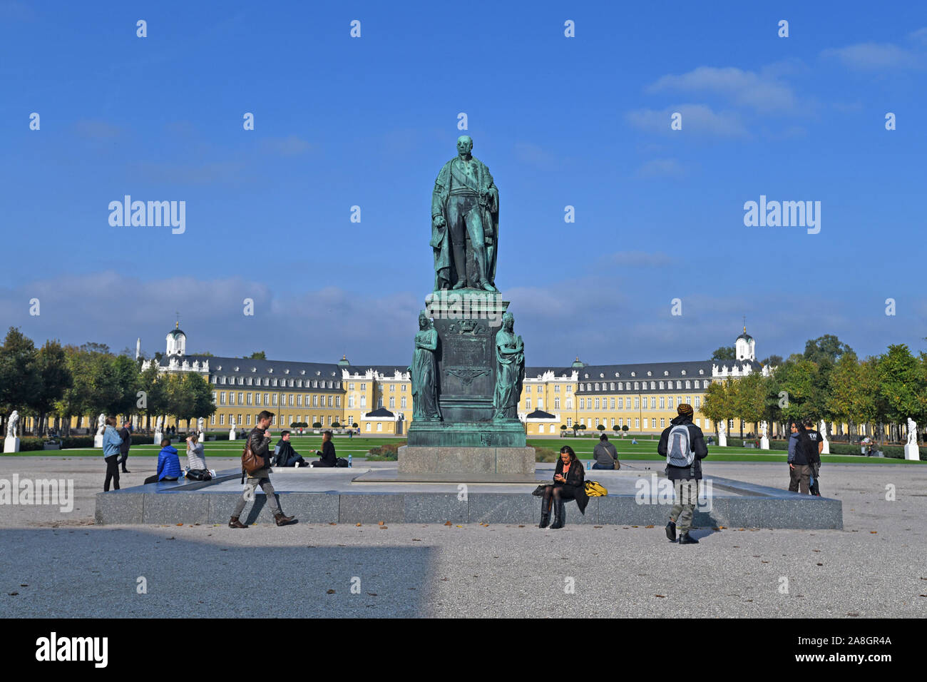 Karlsruhe, Germany, Fountain with monument statue of grand duke of Baden Karl-Friedrich, also calledd Charles Frederick, in front of baroque palace Stock Photo