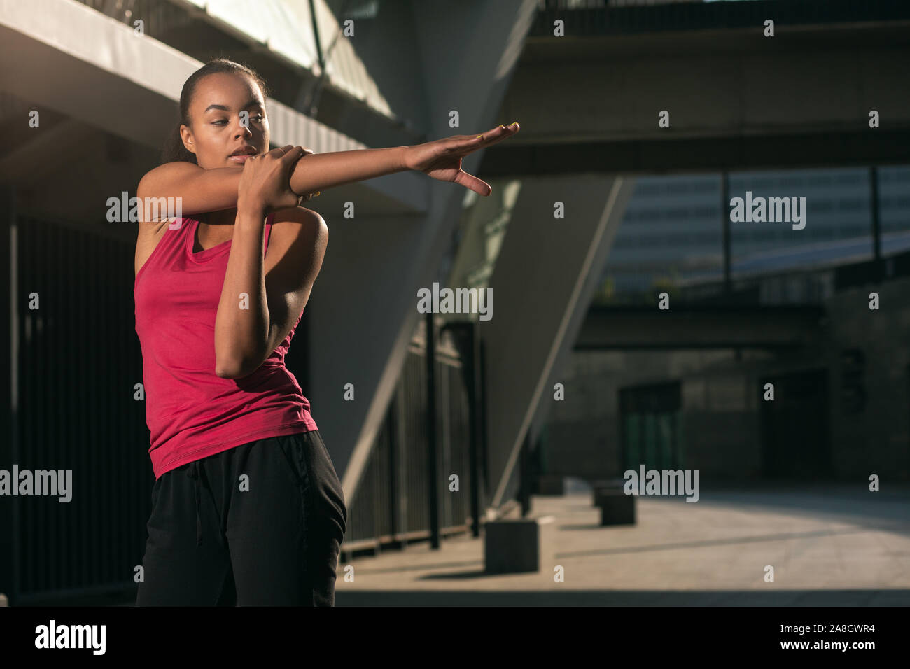 Stretching shoulder muscles before training stock photo Stock Photo