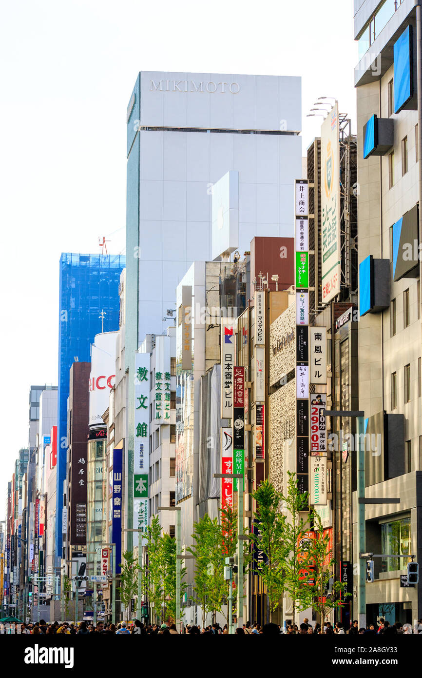 Compressed Perspective View Along The Ginza In Tokyo Various Store Buildings With Street Converted To A Pedestrian Precinct Filled With People Stock Photo Alamy