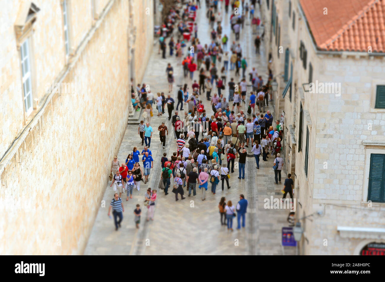 Dubrovnik / Croatia - 10-06-2015 - Interior view of Main Street with Crowd (People) in Old Town (Imperial Fortress) with Miniature (Tilt Shift) Effect Stock Photo