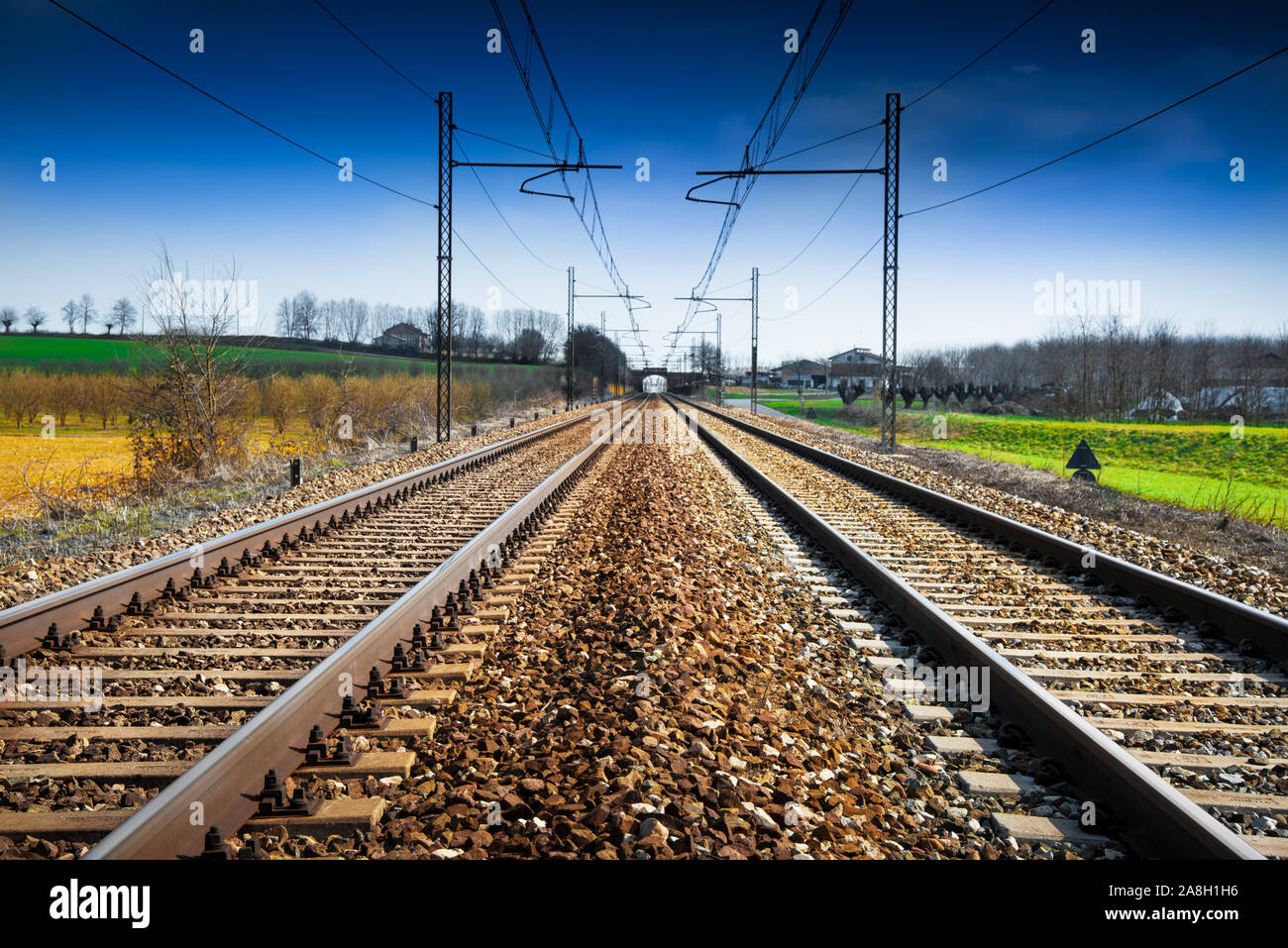 Train rails in country landscape Stock Photo