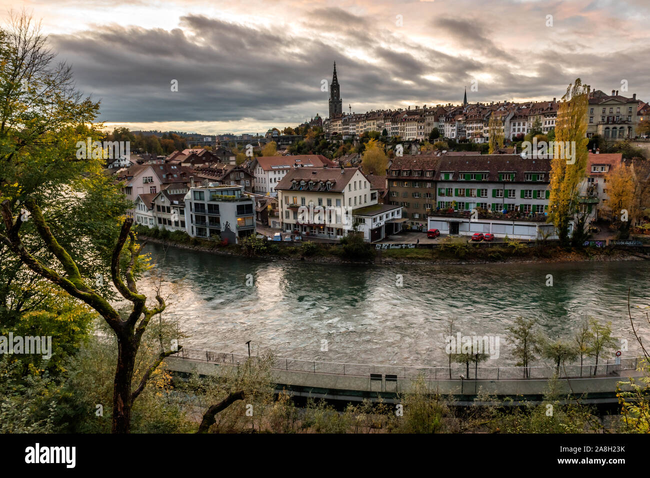 Panoramic view of the Bern old town with the Aare river flowing around the town at sunset in Bern, Switzerland Stock Photo