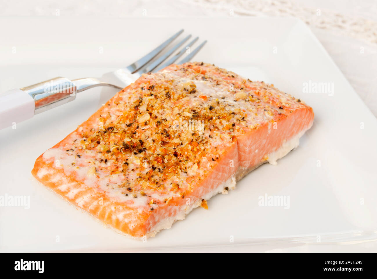 https://c8.alamy.com/comp/2A8H249/baked-alaskan-sockeye-salmon-covered-with-a-lemon-pepper-seasoning-blend-served-on-a-white-plate-selective-focus-and-shallow-dof-2A8H249.jpg