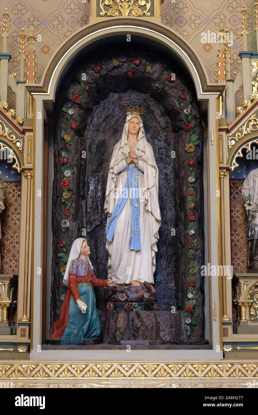 Altar of Our Lady of Lourdes in the church of Saint Matthew in Stitar, Croatia Stock Photo