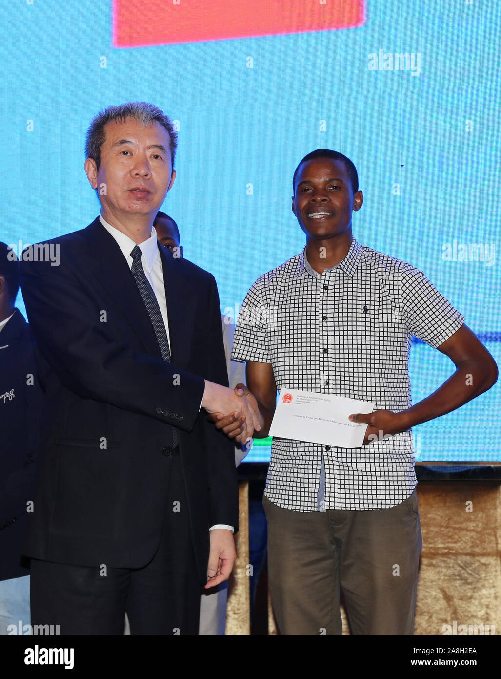 Maputo, Mozambique. 8th Nov, 2019. Chinese Ambassador to Mozambique Su Jian (L) presents the yearly Ambassador Scholarship to a Mozambican student in Maputo, Mozambique, Nov. 8, 2019. Deepened practical cooperation between China and Mozambique will bring more high-quality job opportunities to the southeast African country, said Su Jian at a ceremony to present the yearly Ambassador Scholarship to Mozambican students on Friday. Credit: Nie Zuguo/Xinhua/Alamy Live News Stock Photo