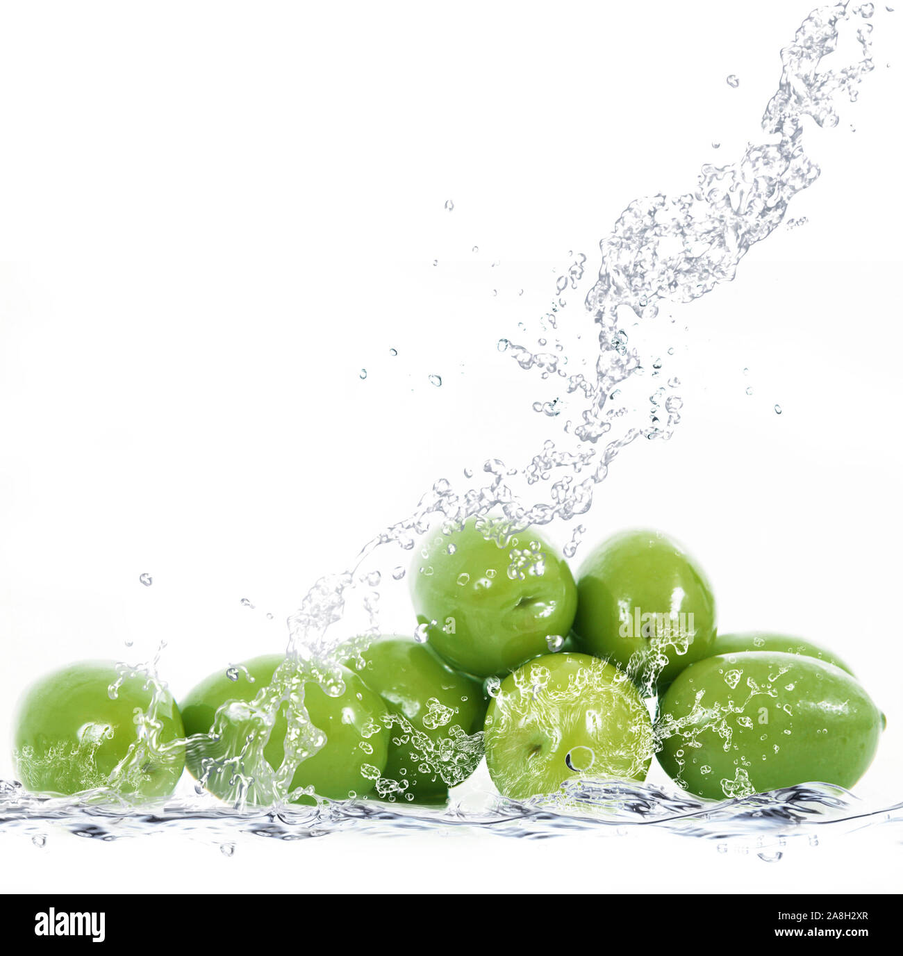 fresh olives falling in pure water Stock Photo Alamy