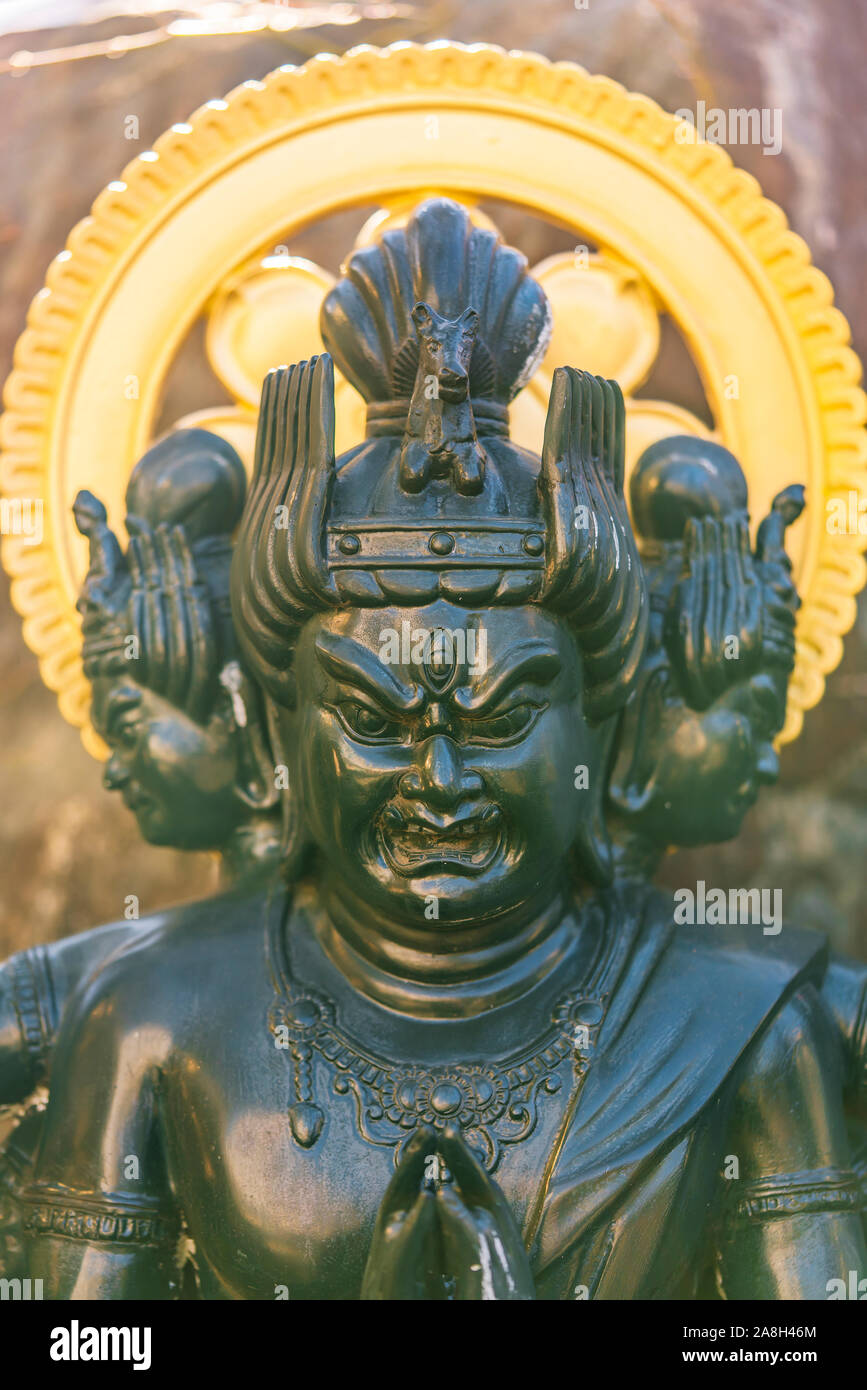 Green bronze statue of the Japanese Buddhist deity animal protector