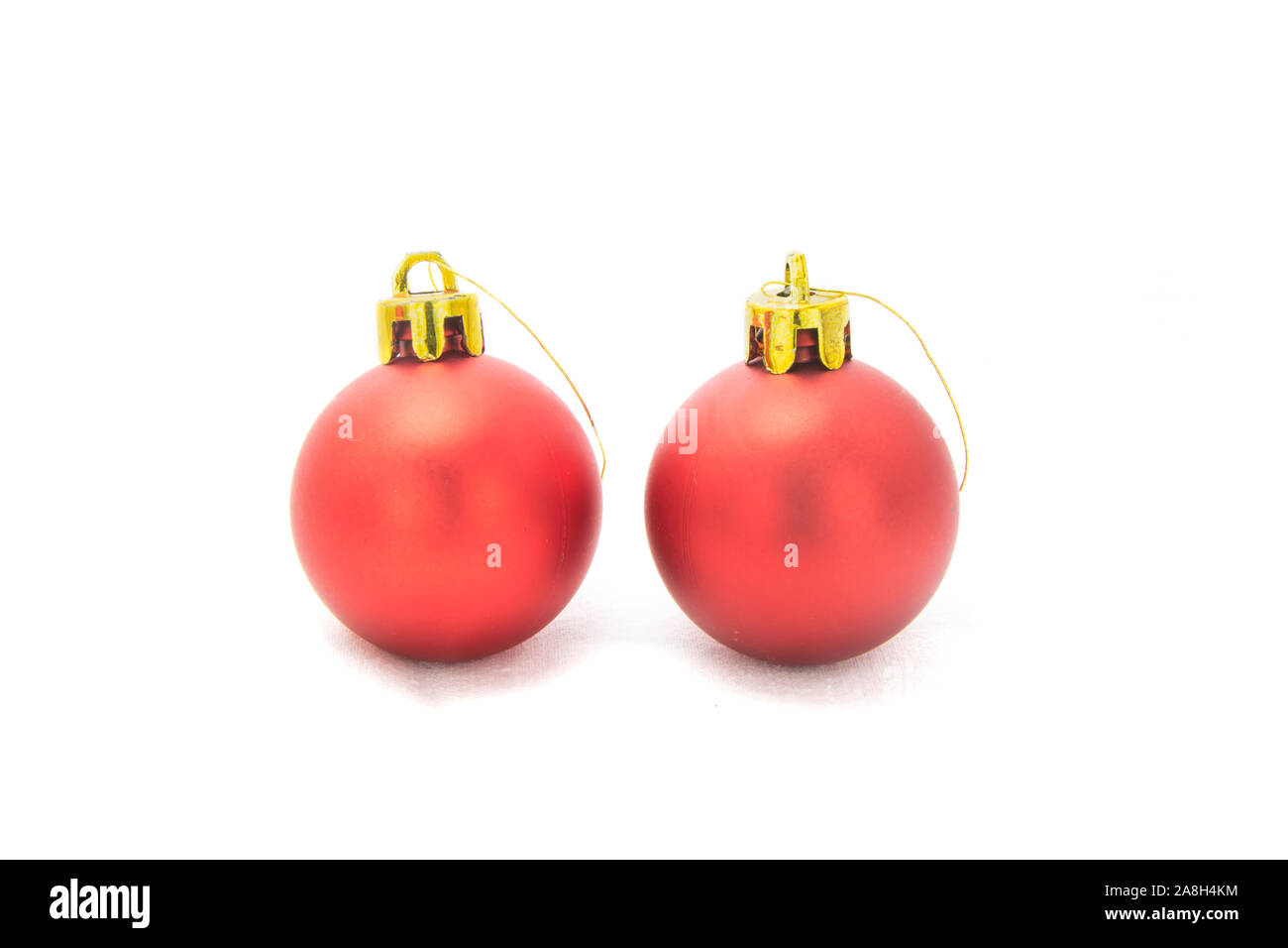 two red christmas balsl isolated on white background. Stock Photo
