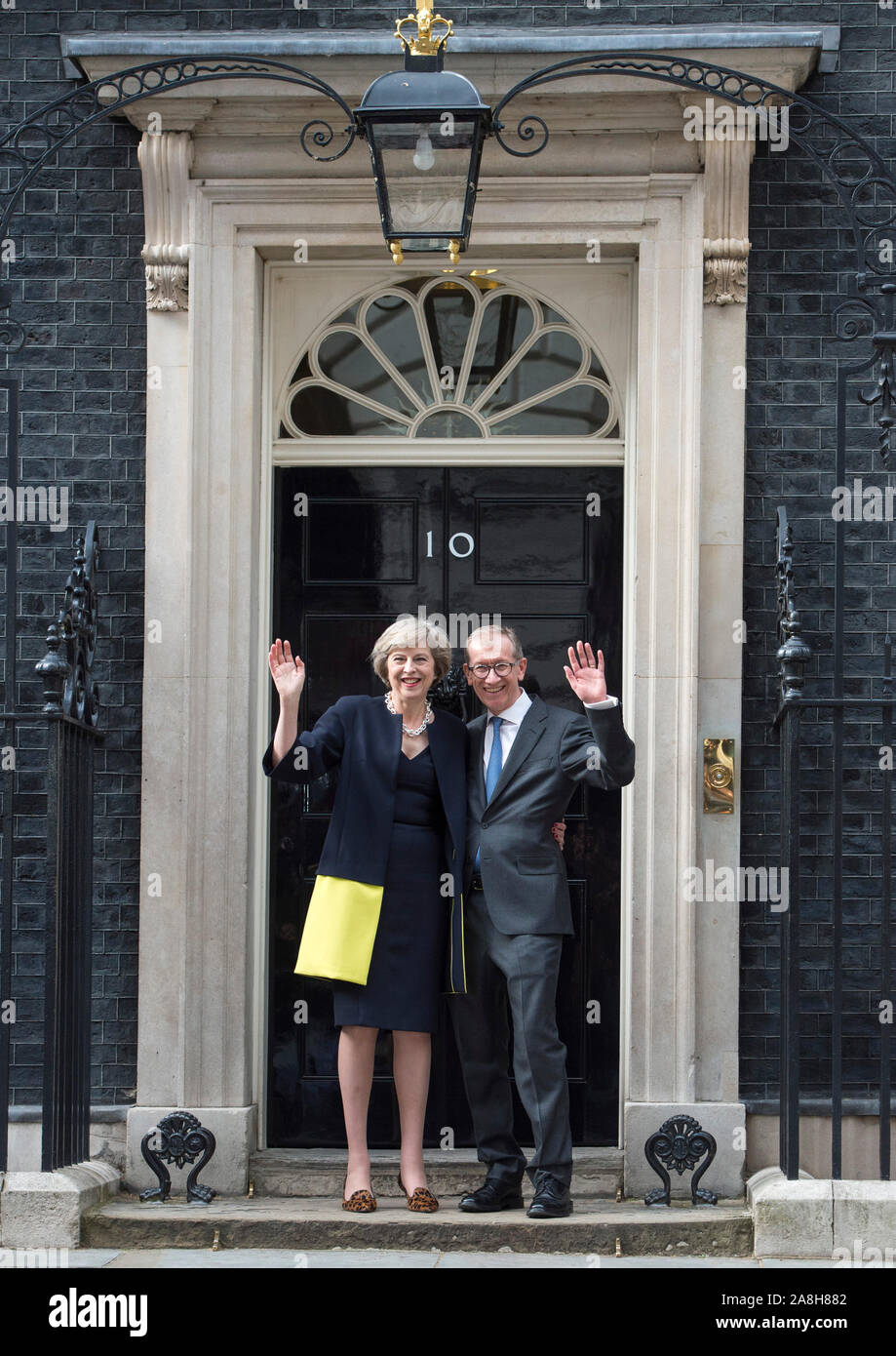 Theresa May and husband Philip arriving in Downing Street for the first time as Prime Minister after her election as leader by conservative members following the resignation of David Cameron. Picture David Parker 13/7/2016 Stock Photo