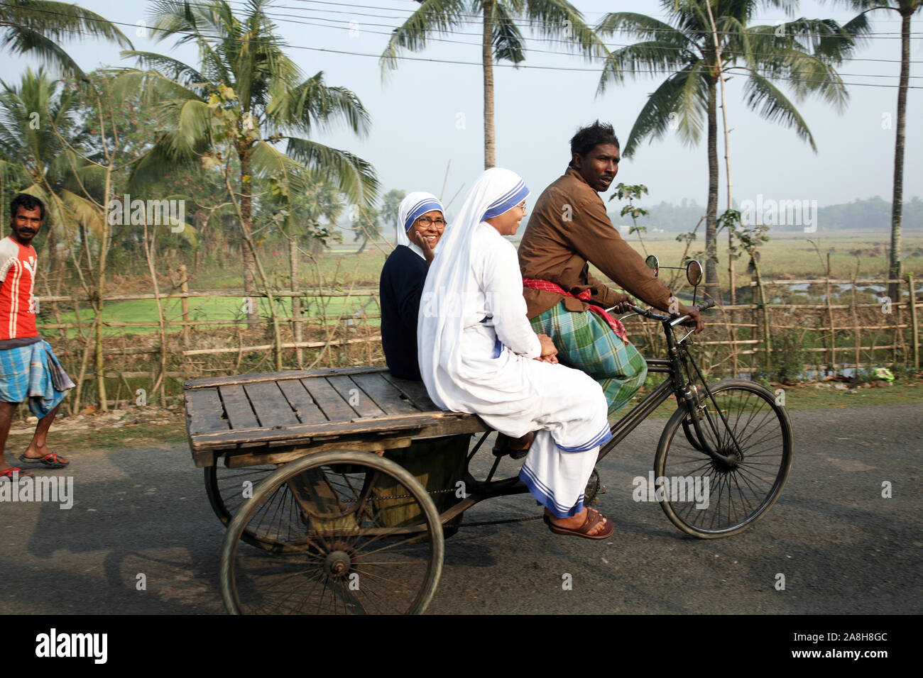 Sisters of Missionaries of Charity of Mother Teresa by rickshaw visit patients in the Sundarbans area in West Bengal, India Stock Photo