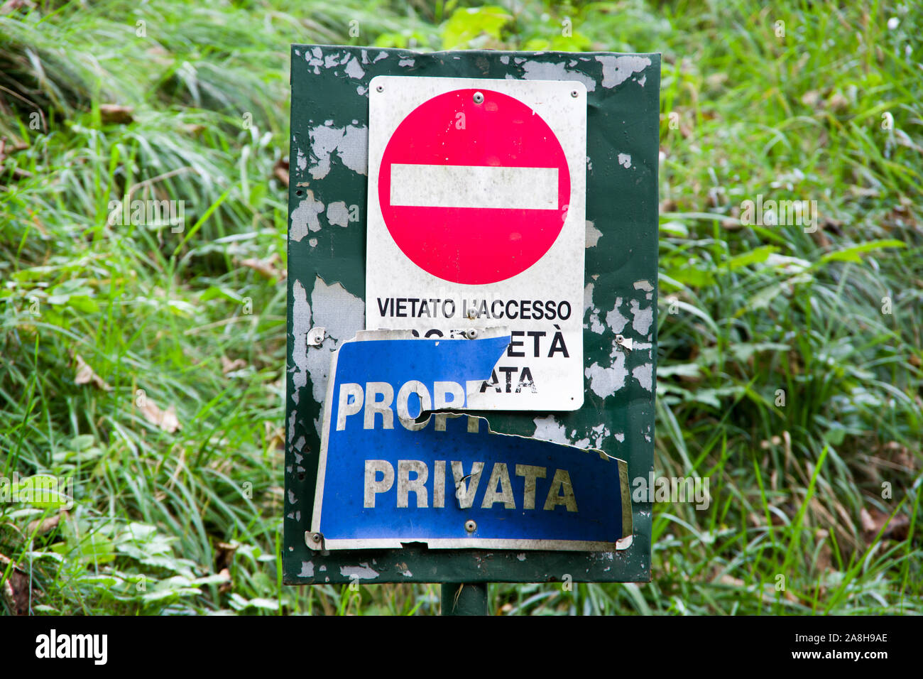 treviso, Italy, 11/21/2019 , Private property sign, old and consumed in a forest. Stock Photo