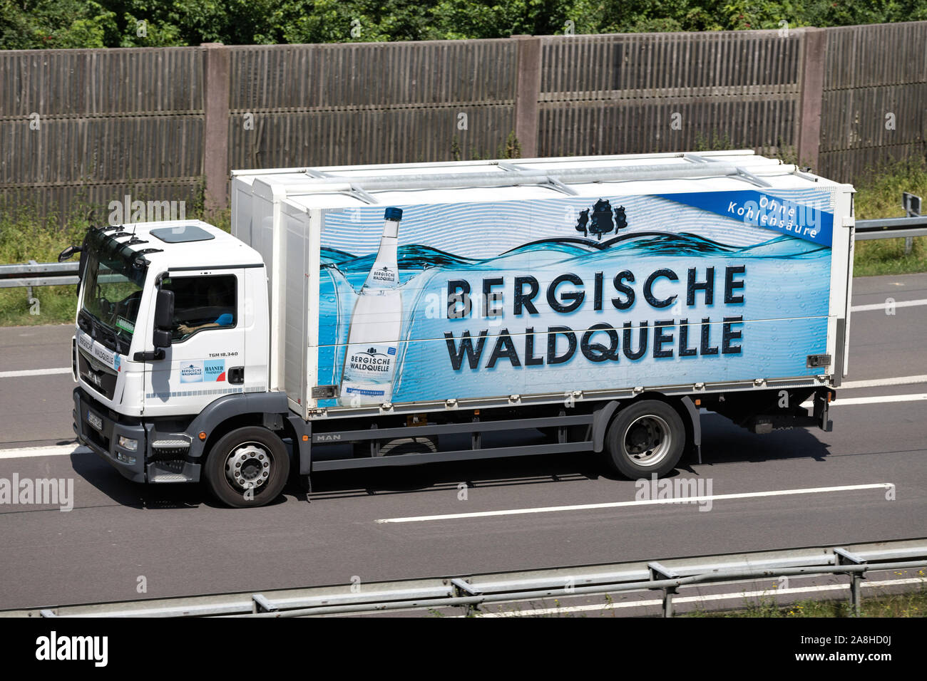 Bergische Waldquelle MAN truck on motorway. Stock Photo