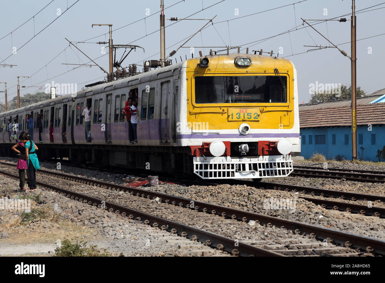 Unidentified locals and tourists commute by train in Kolkata, India Stock Photo